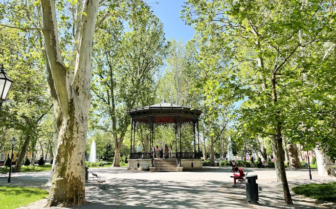 Gazebo in Zagreb park surrounded by trees, part of small group guided tour.