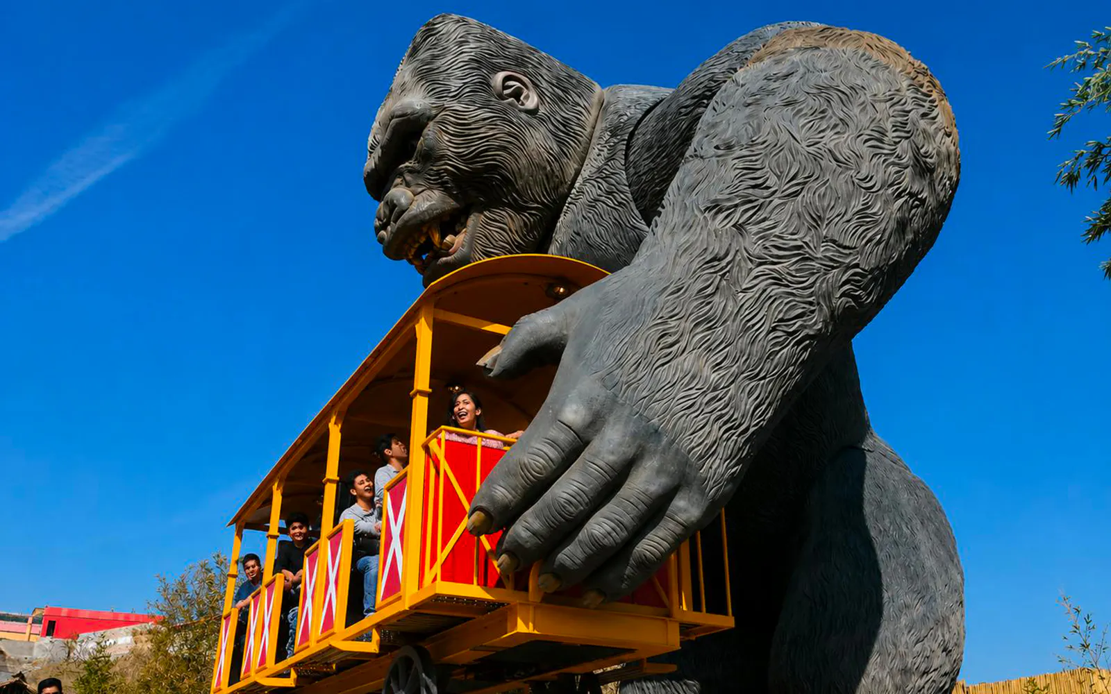 Guests on a ride held by a giant gorilla statue at Vialand Theme Park, Istanbul.