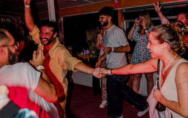 Guests dancing and enjoying DJ performance on Lisbon Sunset Party Cruise.