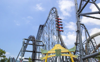 Roller coaster at Fuji-Q Highland, Japan, with riders on a steep drop.
