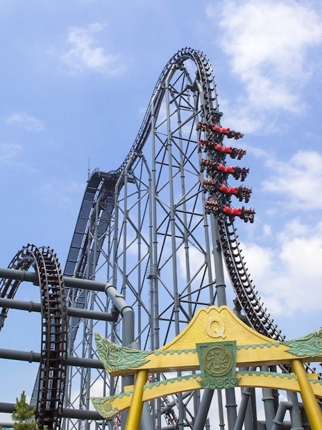 Roller coaster at Fuji-Q Highland, Japan, with riders on a steep drop.