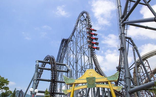 Roller coaster at Fuji-Q Highland, Japan, with riders on a steep drop.