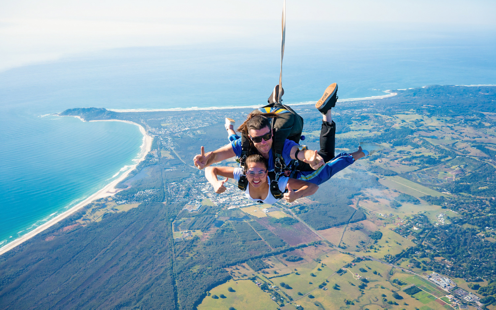 Tandem skydive over Byron Bay coastline at 15,000 feet.