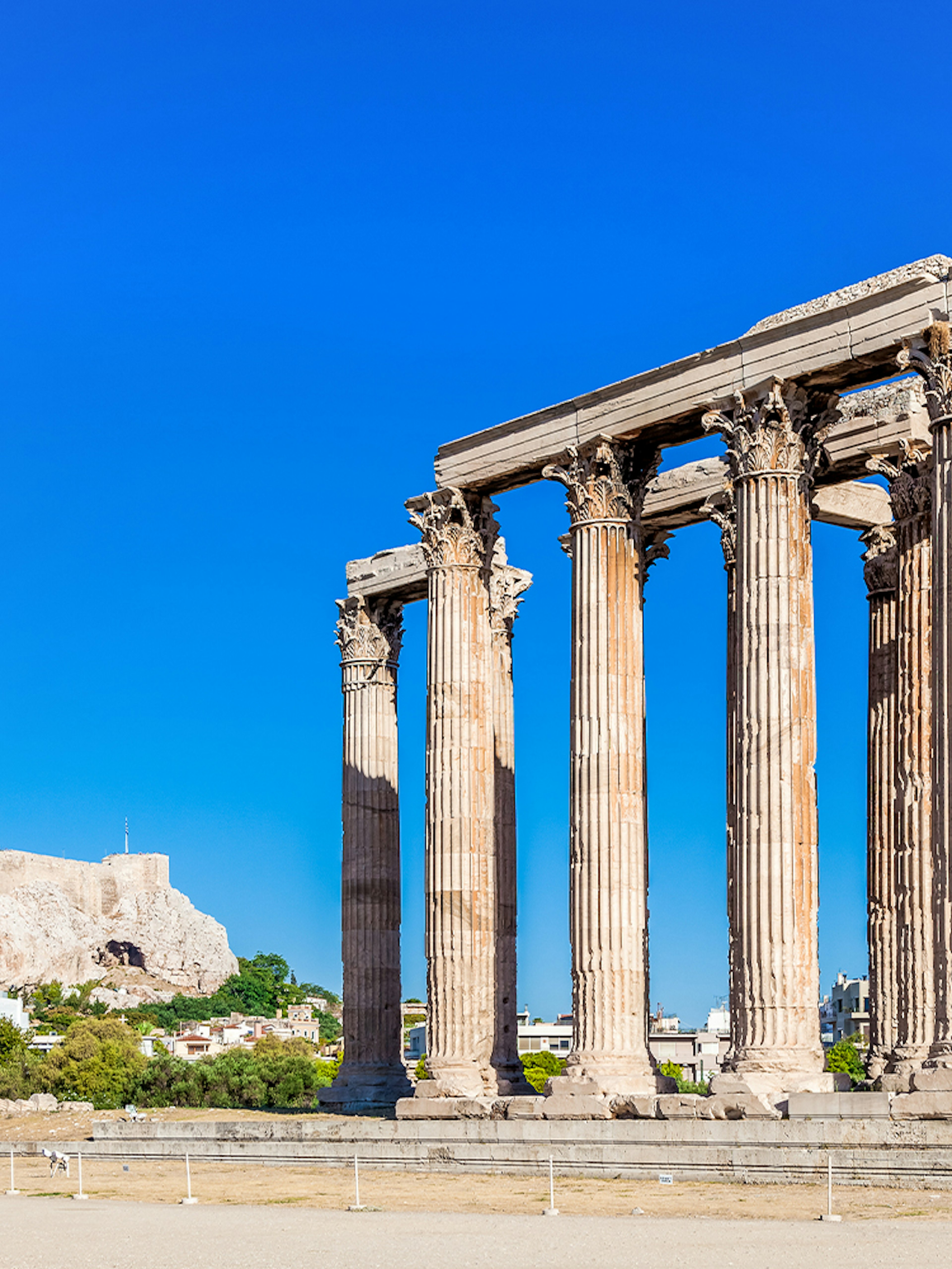 Temple of Olympian Zeus with Acropolis Hill in the background, Athens.