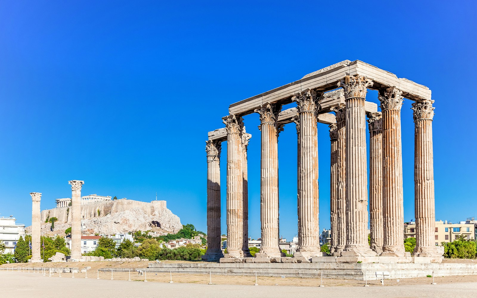 Temple of Olympian Zeus with Acropolis Hill in the background, Athens.