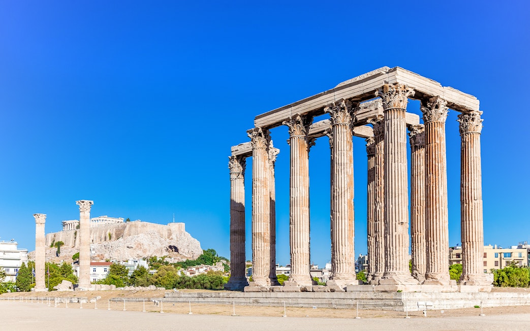 Temple of Olympian Zeus with Acropolis Hill in the background, Athens.