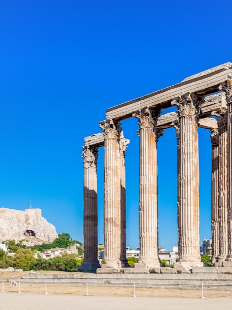 Temple of Olympian Zeus with Acropolis Hill in the background, Athens.