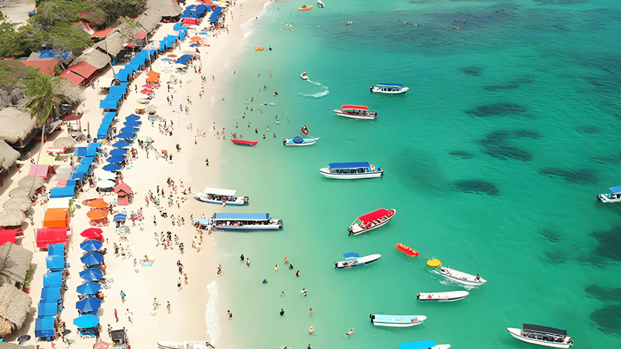 Beachgoers and boats at Rosario Islands, Cartagena, Colombia.