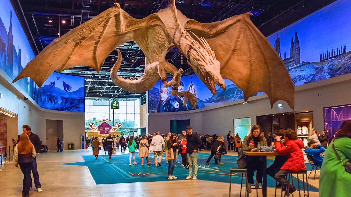 Dragon sculpture in cafeteria area of Harry Potter London tour.