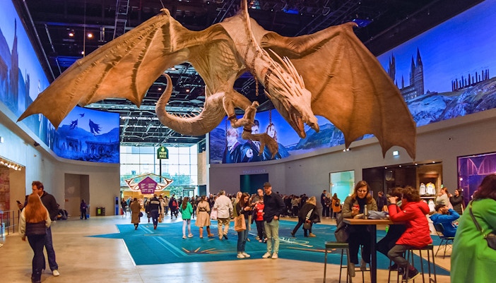 Dragon sculpture in cafeteria area of Harry Potter London tour.