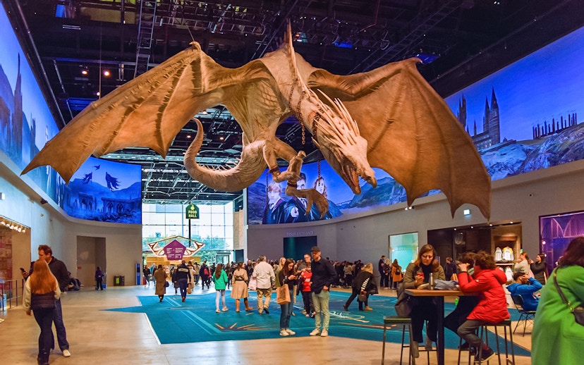 Dragon sculpture in cafeteria area of Harry Potter London tour.