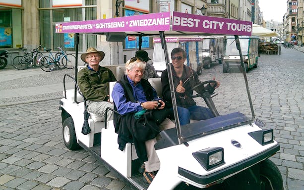 Group of people driving an electric car in Wroclaw
