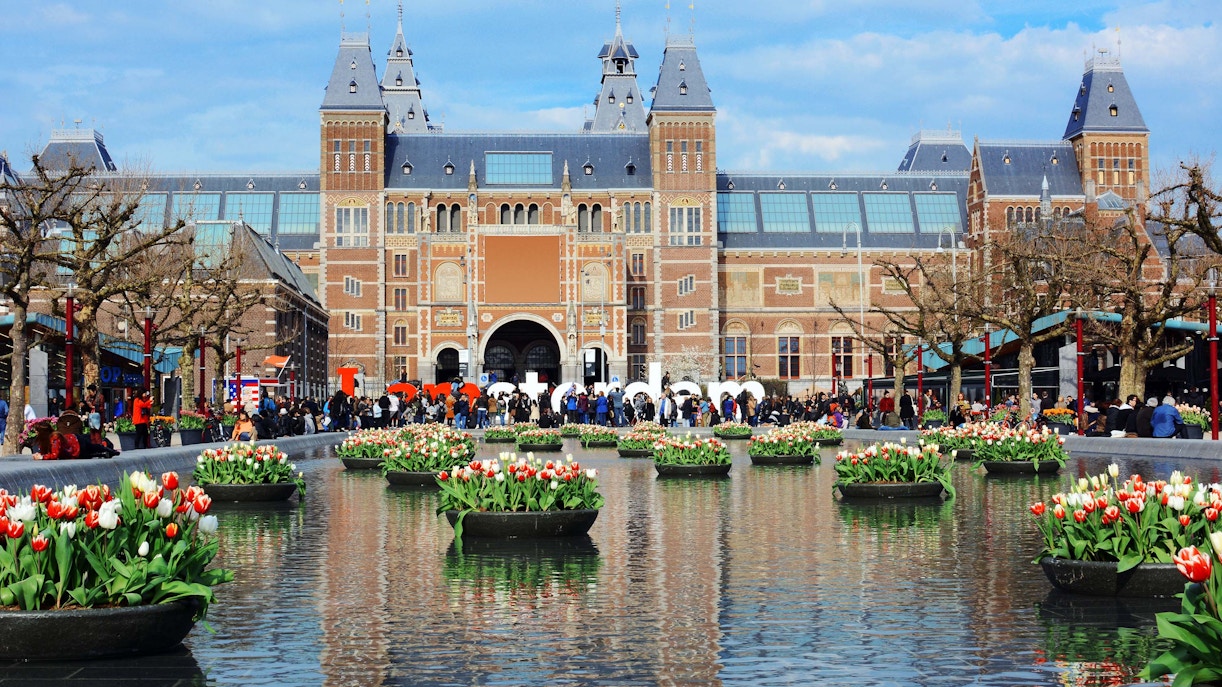 Rijksmuseum Gardens with sculptures and manicured lawns in Amsterdam, Netherlands.