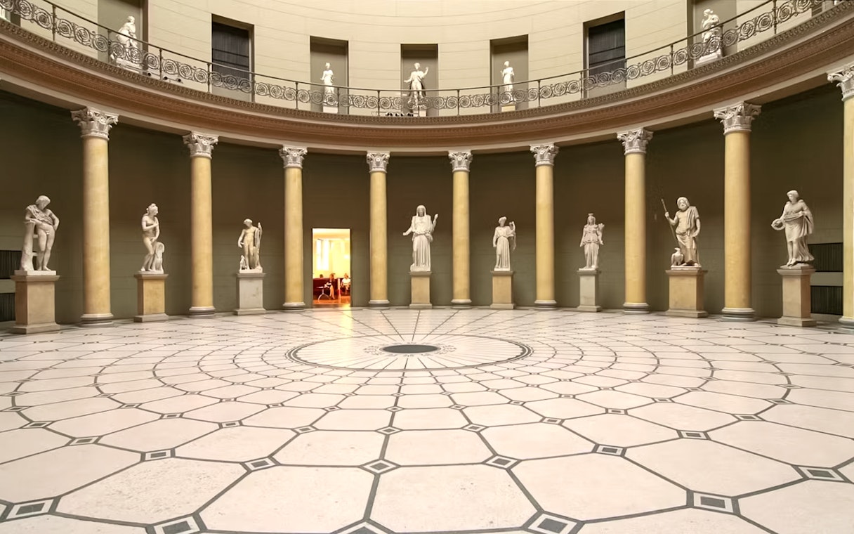 Interior of Altes Museum with classical statues and columns, Berlin.