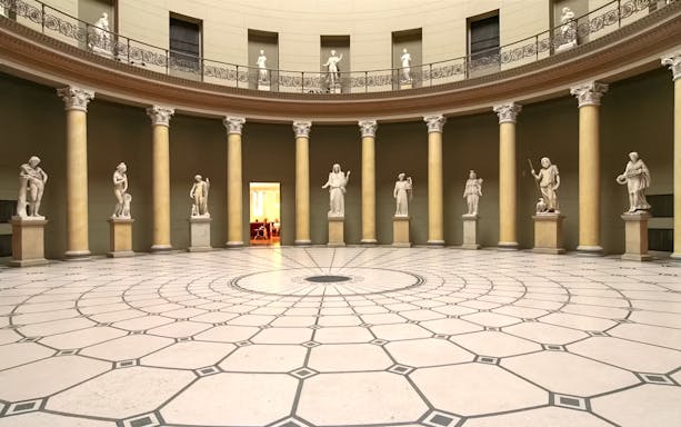 Interior of Altes Museum with classical statues and columns, Berlin.