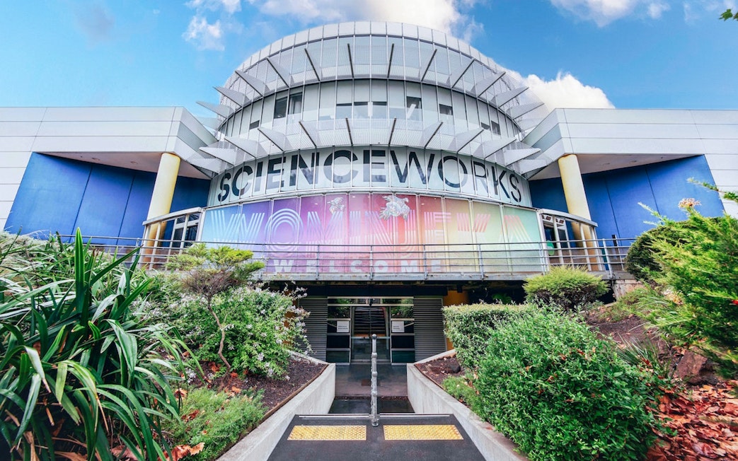 Exterior of Scienceworks museum with colorful entrance signage during daytime.