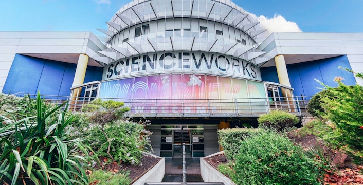 Exterior of Scienceworks museum with colorful entrance signage during daytime.