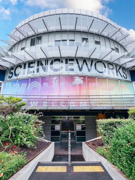 Exterior of Scienceworks museum with colorful entrance signage during daytime.