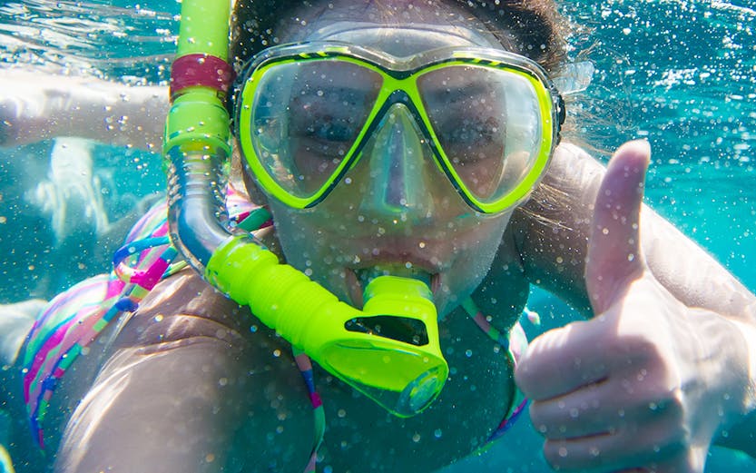 Snorkeler giving thumbs up at Irukandji Shark & Ray Encounters.
