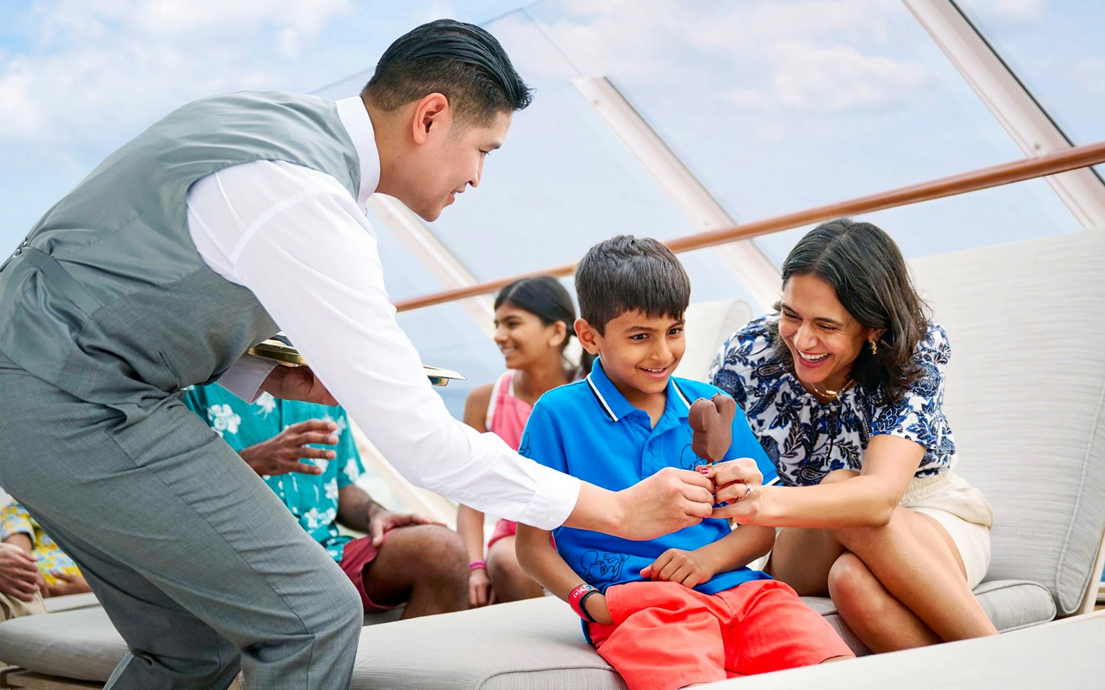 Disney Adventure Cruise guests enjoying onboard service.