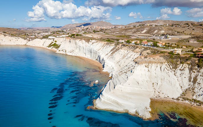 Scala Dei Turchi cliffs and coastline in Sicily, Italy, viewed from the sea.
