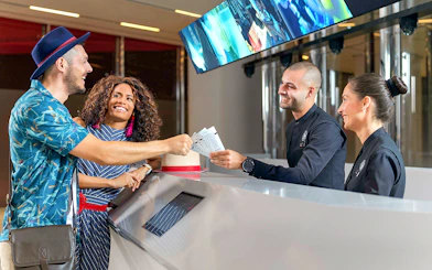 Visitors receiving tickets for Burj Khalifa's SKY level observation deck in Dubai.