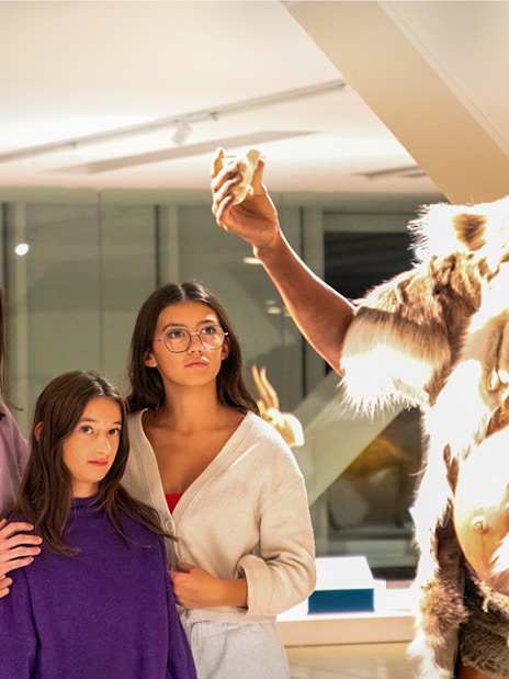 Visitors observing a prehistoric exhibit at Cosquer Cave, Marseille.