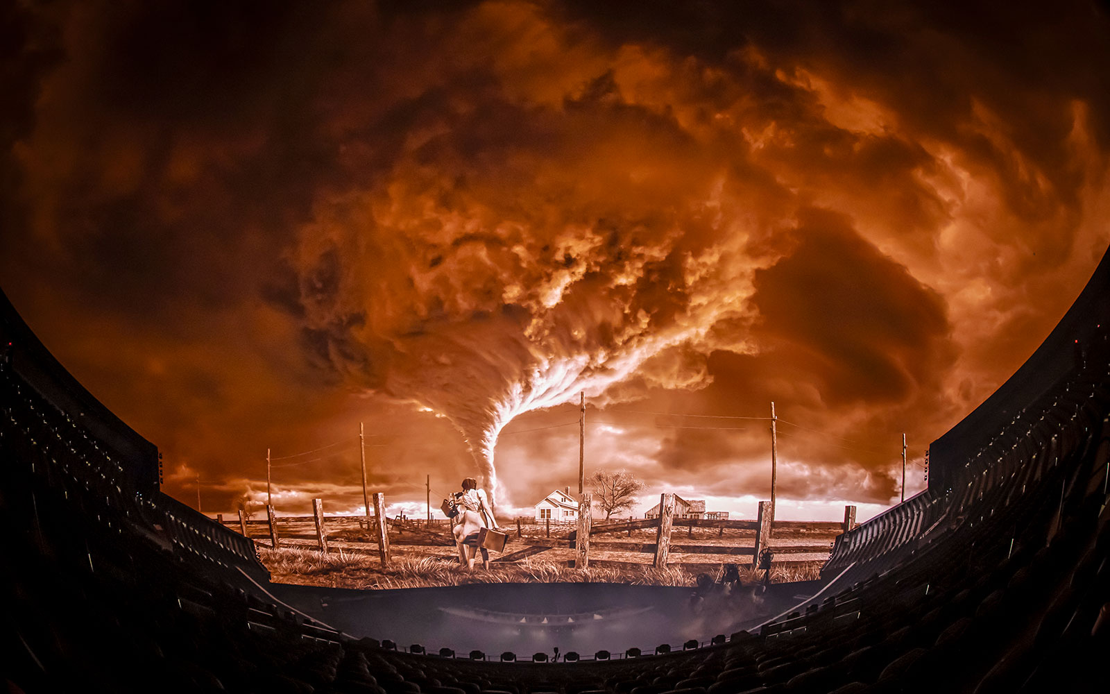 Tornado scene from Wizard of Oz show at Sphere, featuring a farmhouse and dramatic sky.