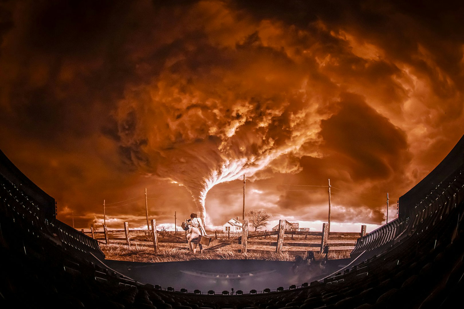 Tornado scene from Wizard of Oz show at Sphere, featuring a farmhouse and dramatic sky.