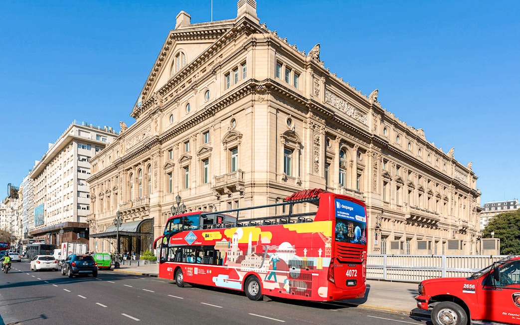 Hop on Hop off bus passing Teatro Colón, Buenos Aires.
