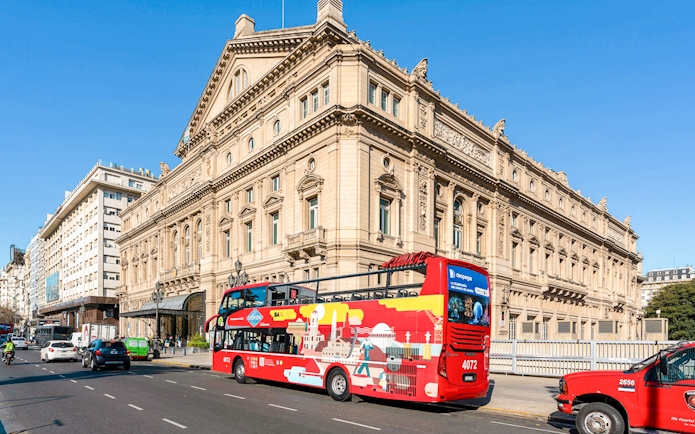 Hop on Hop off bus passing Teatro Colón, Buenos Aires.