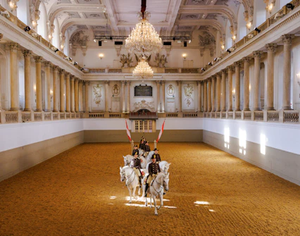 Lippizans performing at the Spanish Riding School arena in Vienna.