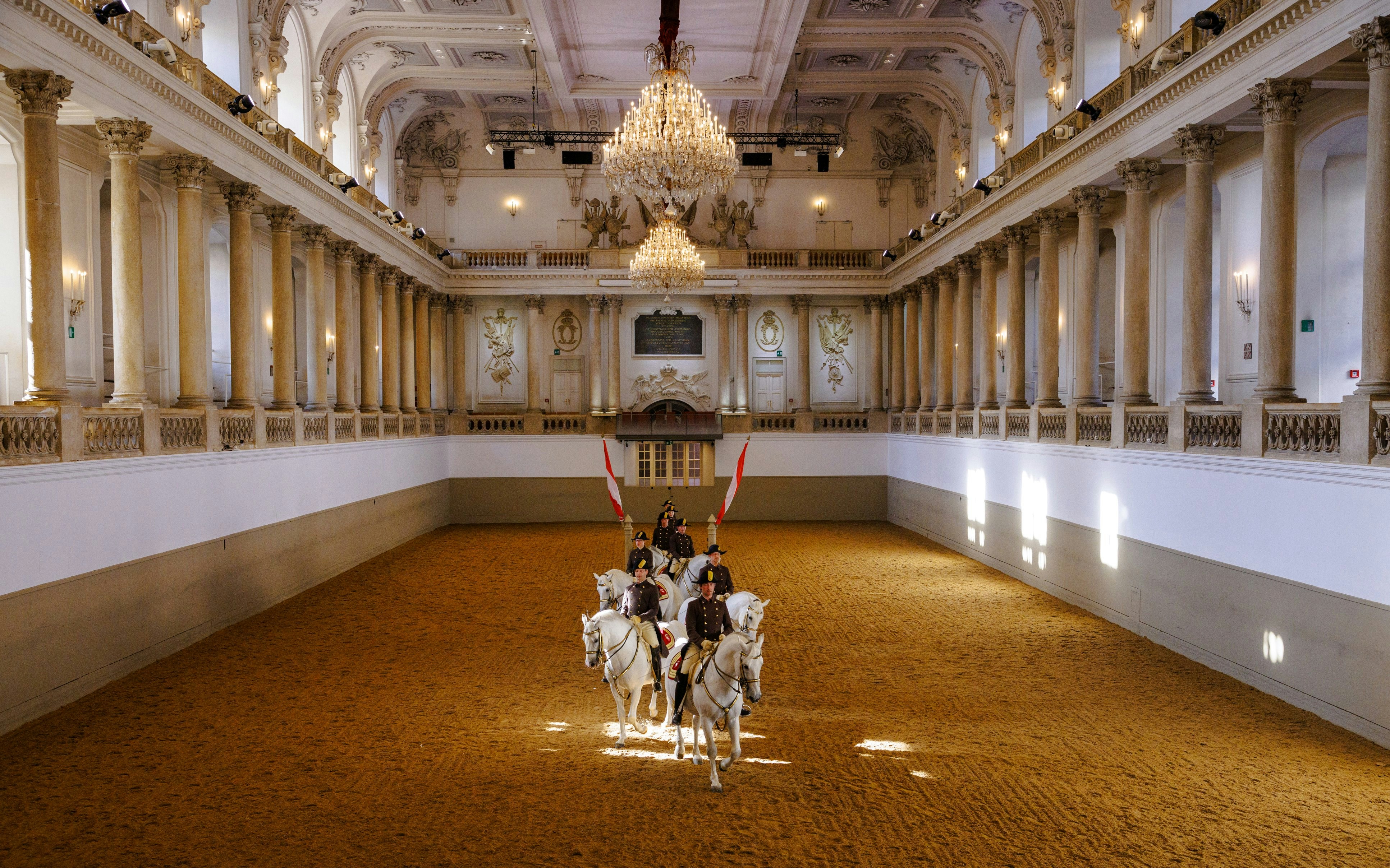 Lippizans performing at the Spanish Riding School arena in Vienna.