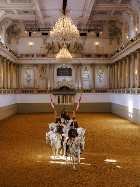 Lippizans performing at the Spanish Riding School arena in Vienna.