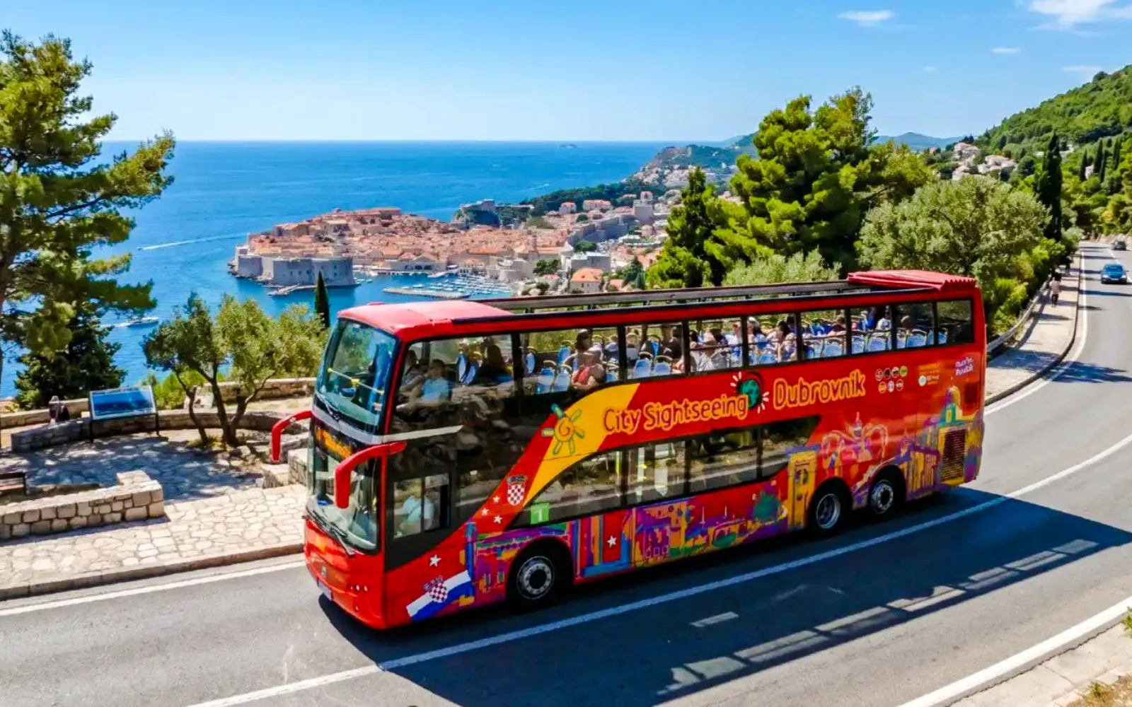 Hop on Hop Off bus overlooking Dubrovnik's Old Town and Adriatic Sea.