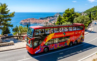 Hop on Hop Off bus overlooking Dubrovnik's Old Town and Adriatic Sea.