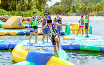 Participants enjoying inflatable obstacle course at HydroDash Singapore.