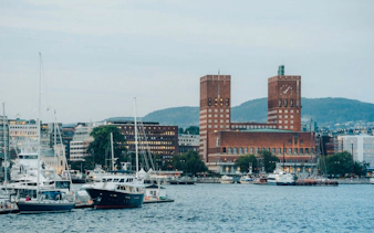 Oslo City Hall and harbor view during the Oslo Essential Highlights Tour.