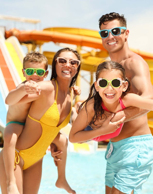 Family enjoying slides at A'Famosa Waterpark, Malaysia.