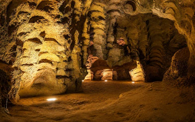 Hercules Cave interior with illuminated rock formations in Tangier, Morocco.