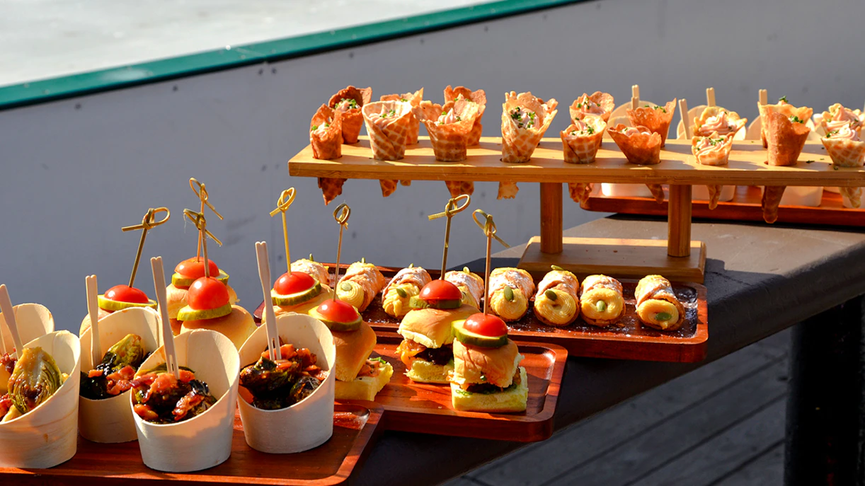 Assorted appetizers displayed at Wollman ICE Rink event in New York City.