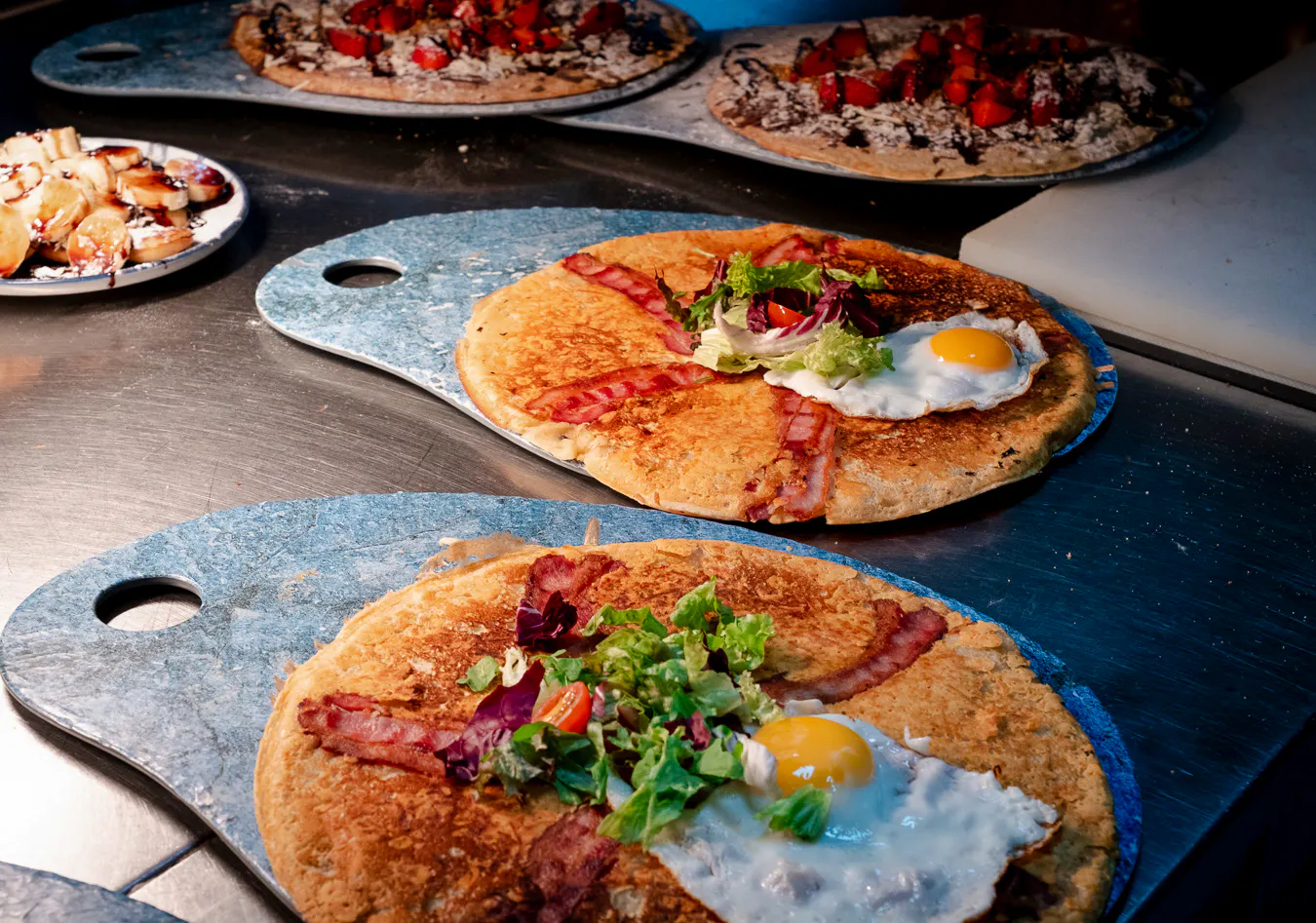 Dutch pancakes with bacon, egg, and salad served during Rembrandt tour brunch in Amsterdam.