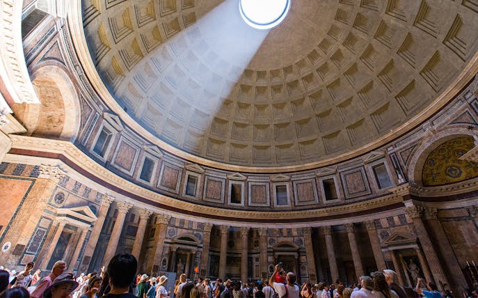 Dome of the Pantheon in Rome with sunlight streaming through the oculus.