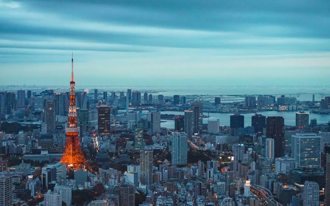 Tokyo skyline with illuminated Tokyo Tower at dusk, viewed from the Tokyo City View Observation Deck.