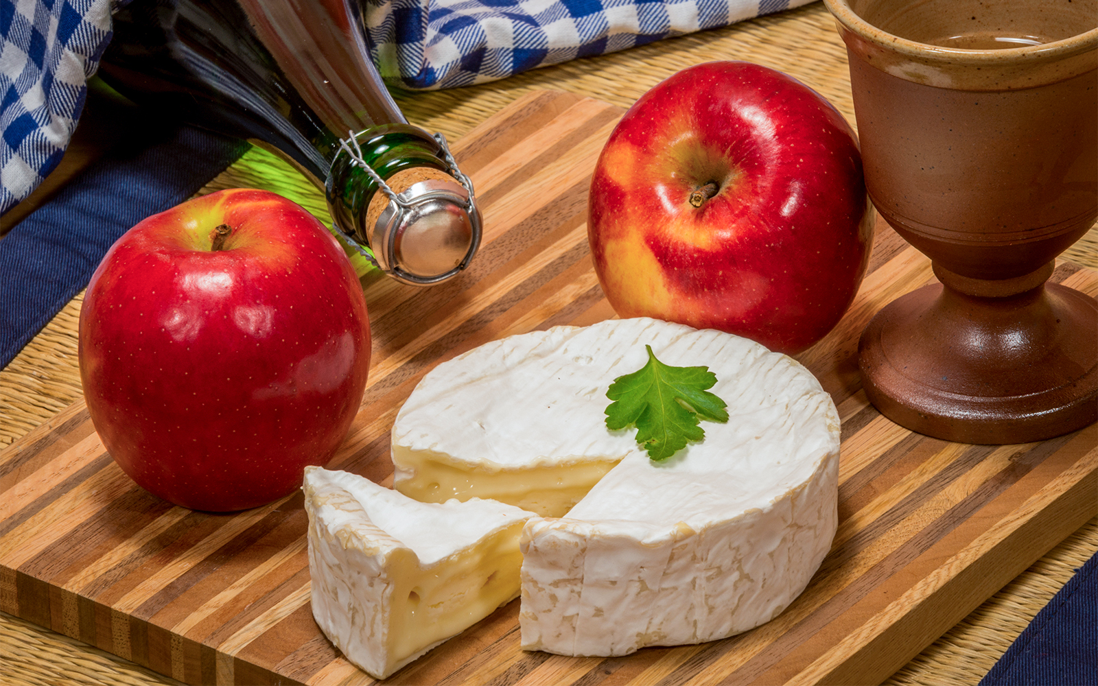 Visitors sampling apple cider at a Normandy D-Day tour in France.