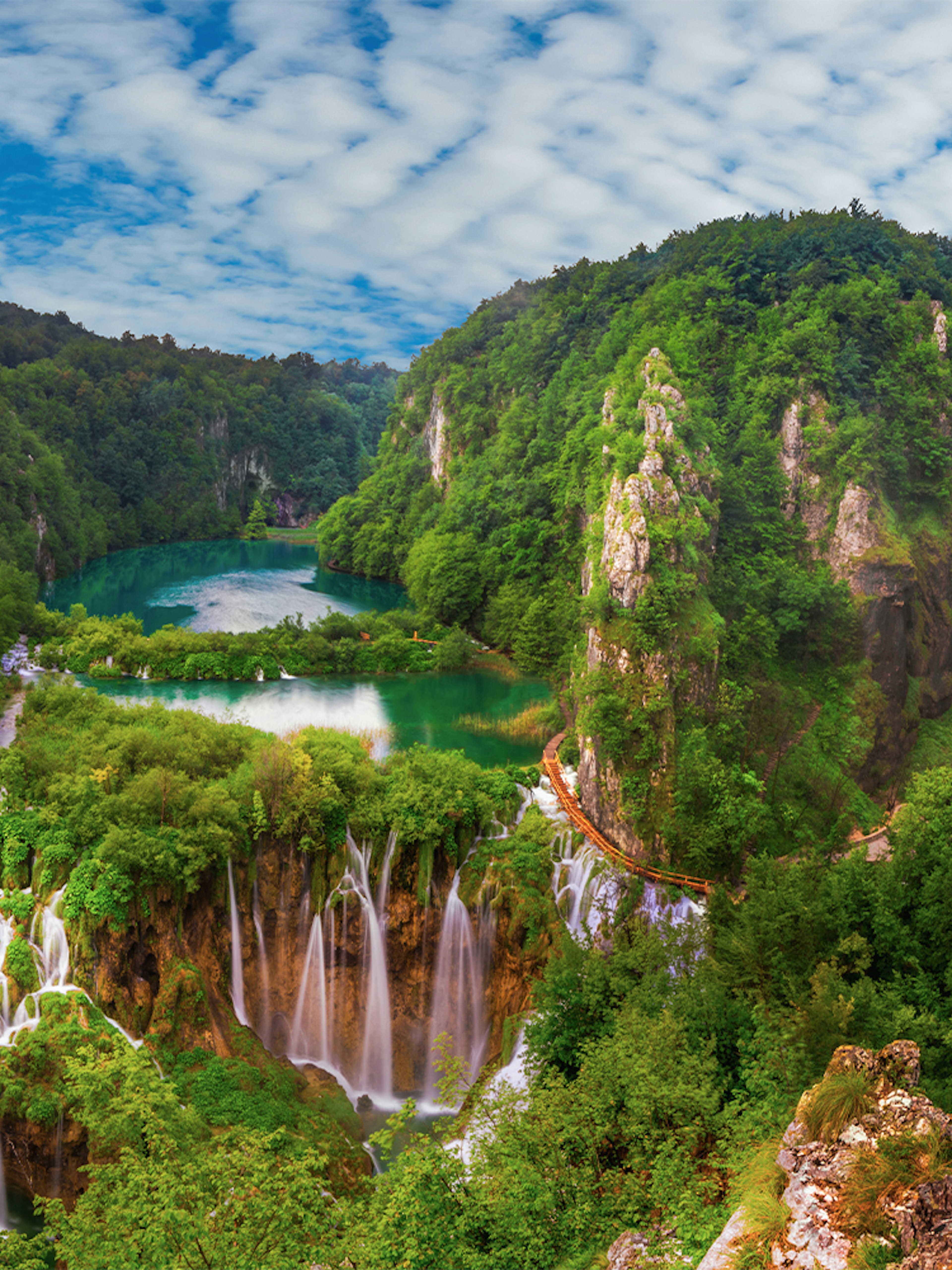 Plitvice Lakes waterfalls and lush greenery viewed from Zadar.