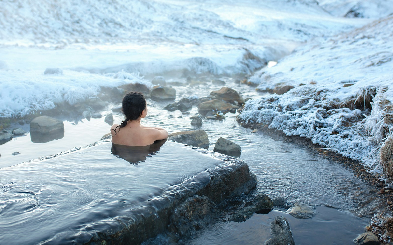 Blue Lagoon geothermal spa in Iceland with visitors enjoying the warm, mineral-rich waters.