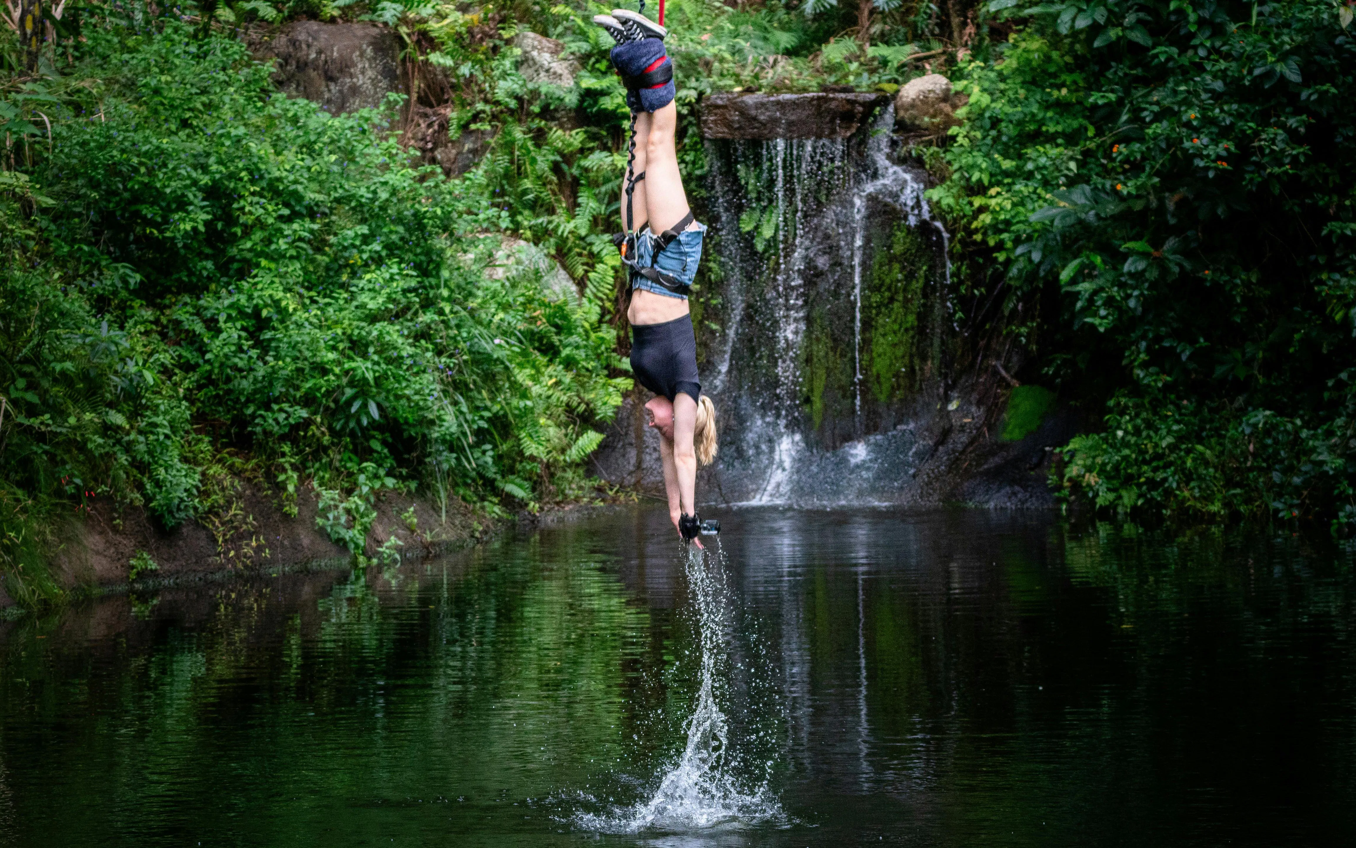 Visitor bungy jumping with water touch at Skypark Cairns.