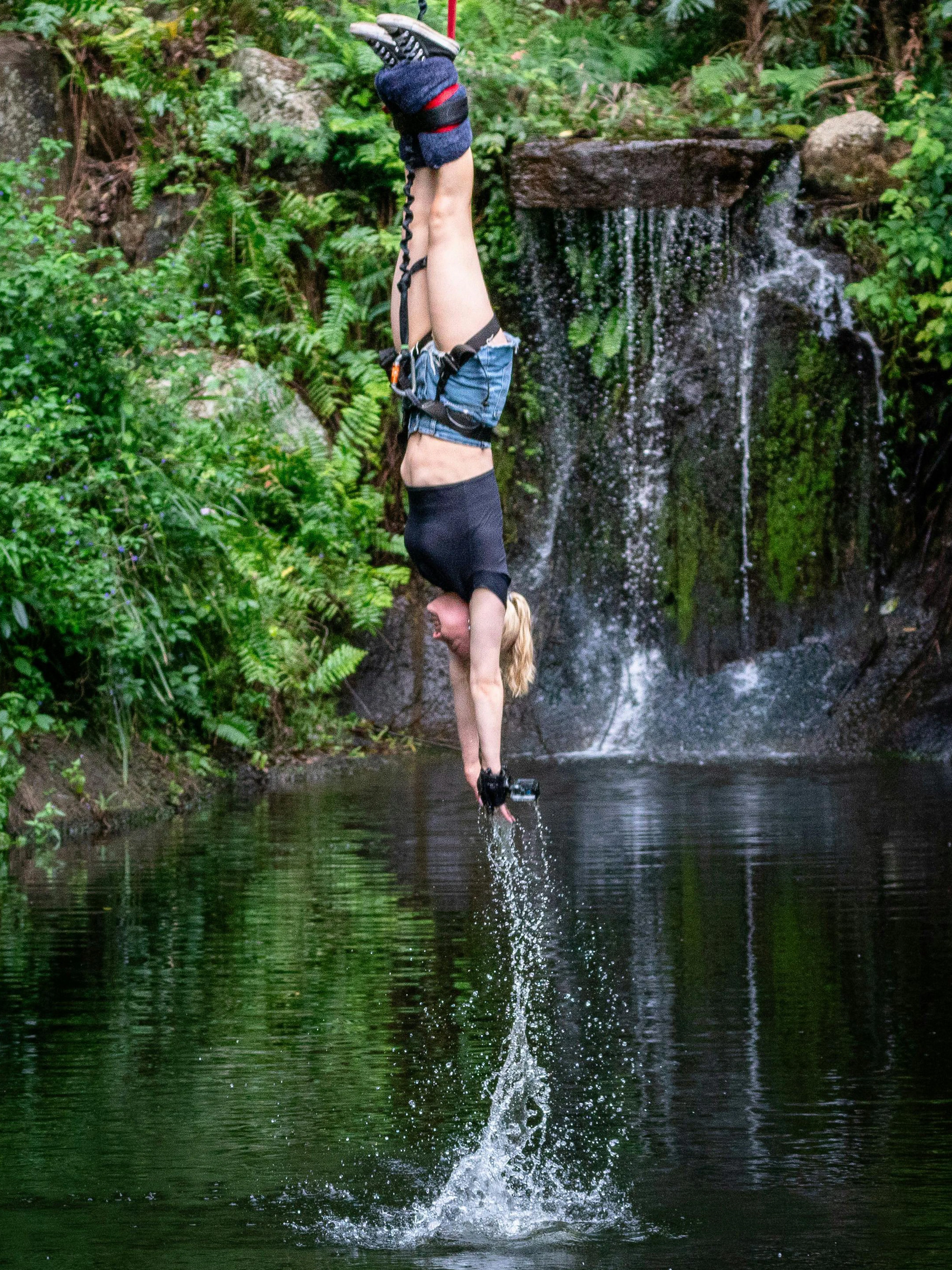 Visitor bungy jumping with water touch at Skypark Cairns.