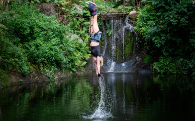 Visitor bungy jumping with water touch at Skypark Cairns.